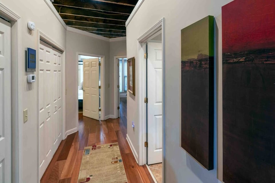 This is the view from the hallway that leads to the bathroom and bedrooms. 