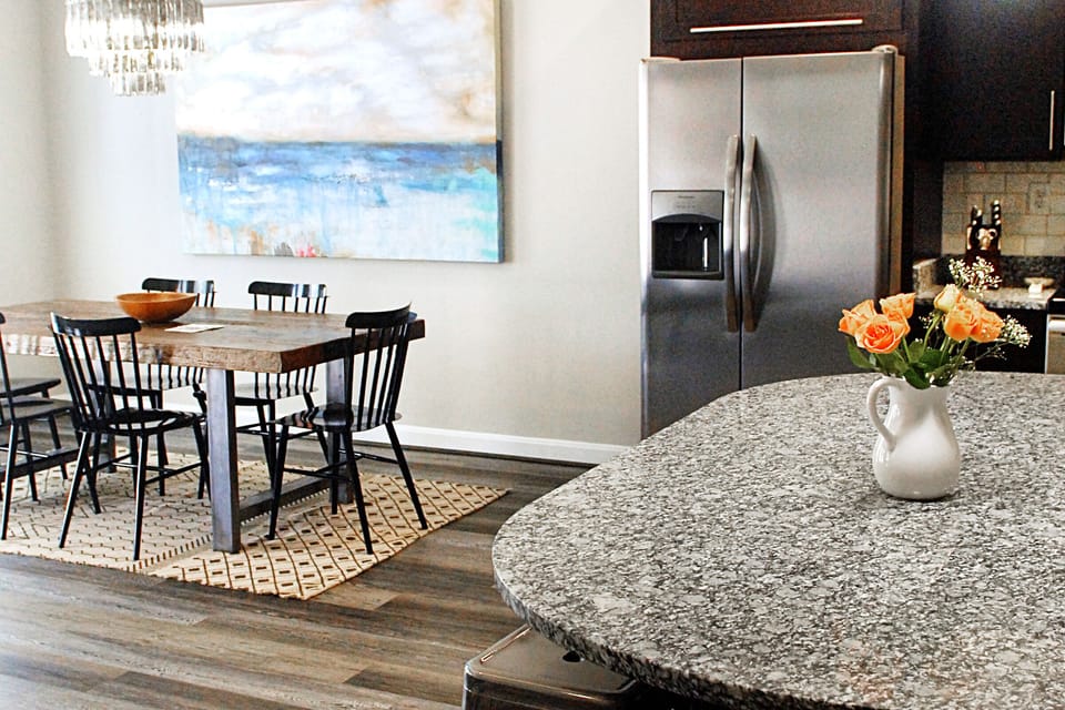 Granite island and dining room table seats 14 people