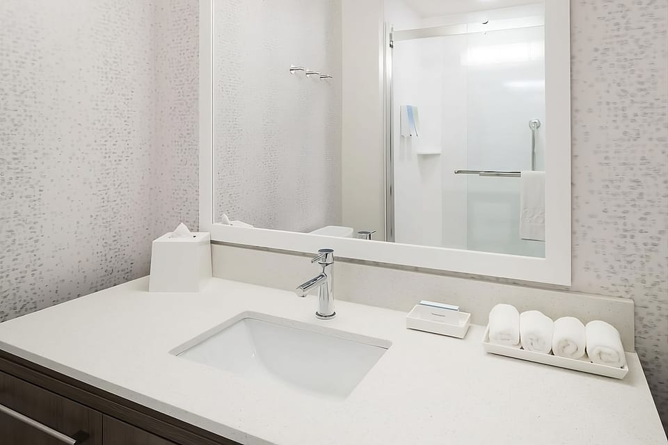 Refresh effortlessly with bright vanity space and a clean shower.