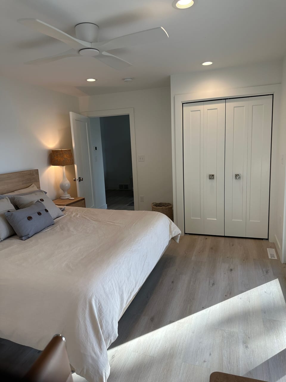 Main level king bedroom with view onto living area