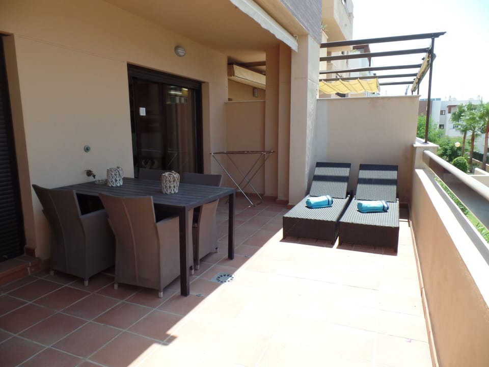 Spacious, elevated balcony, with outdoor furniture for al fresco dining
