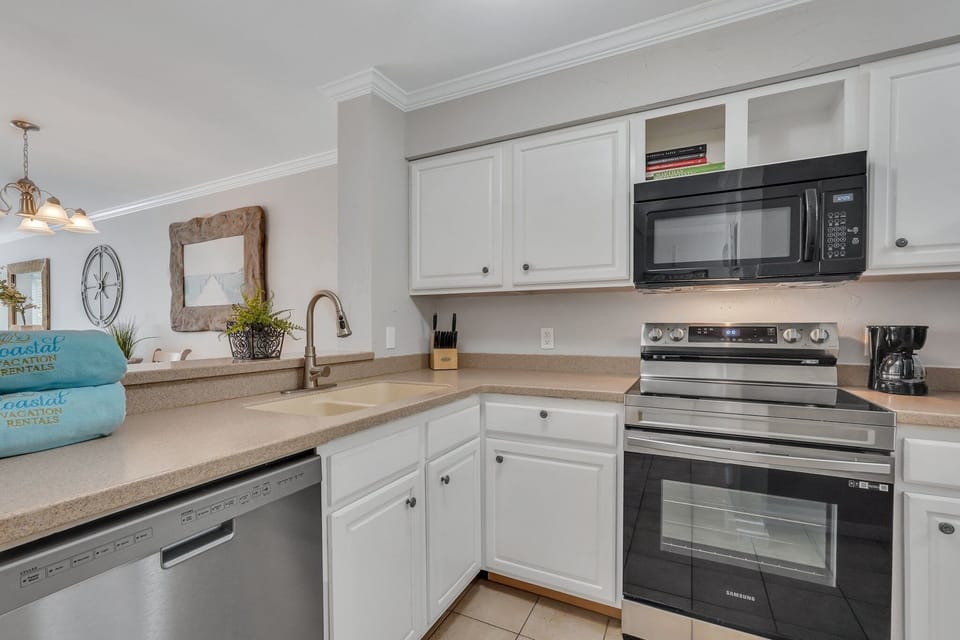Kitchen with stainless steel appliances.