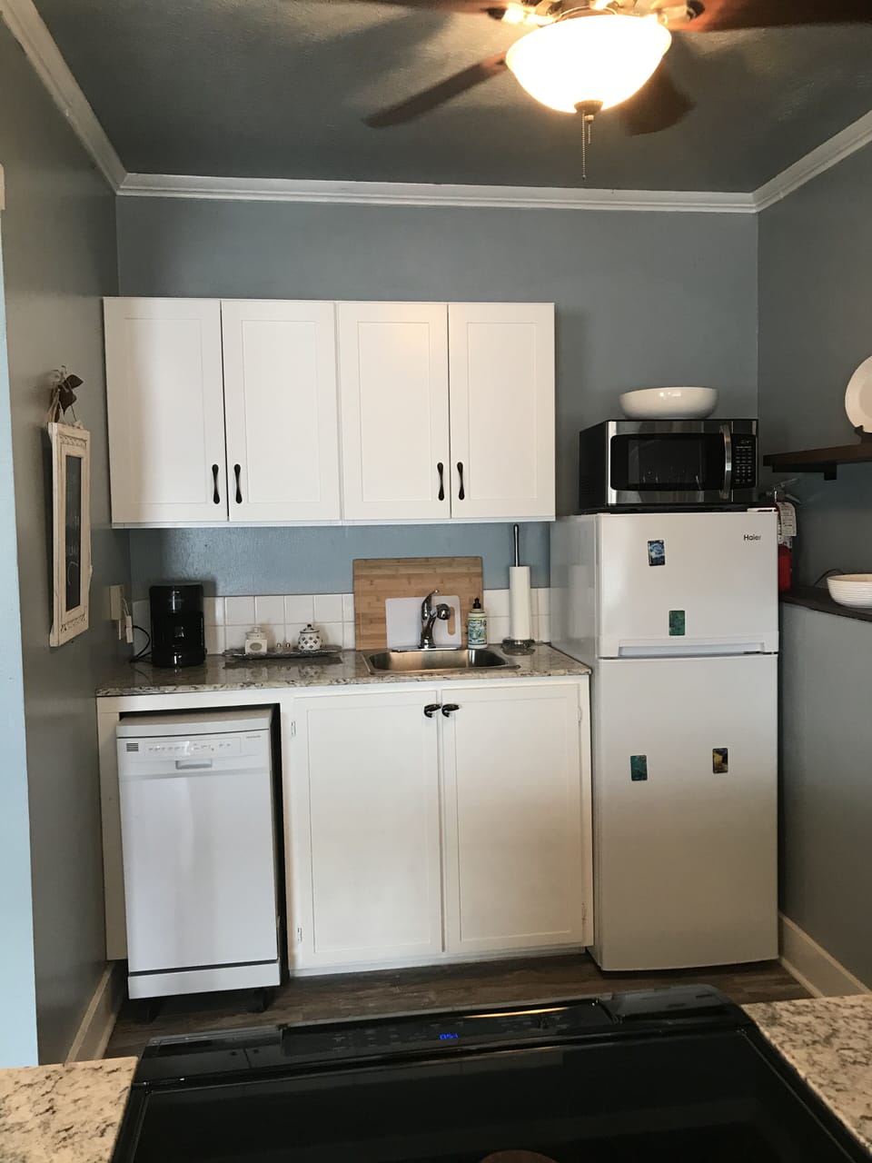 New kitchen appliances include, mini dishwasher, sink, refrigerator & cabinets