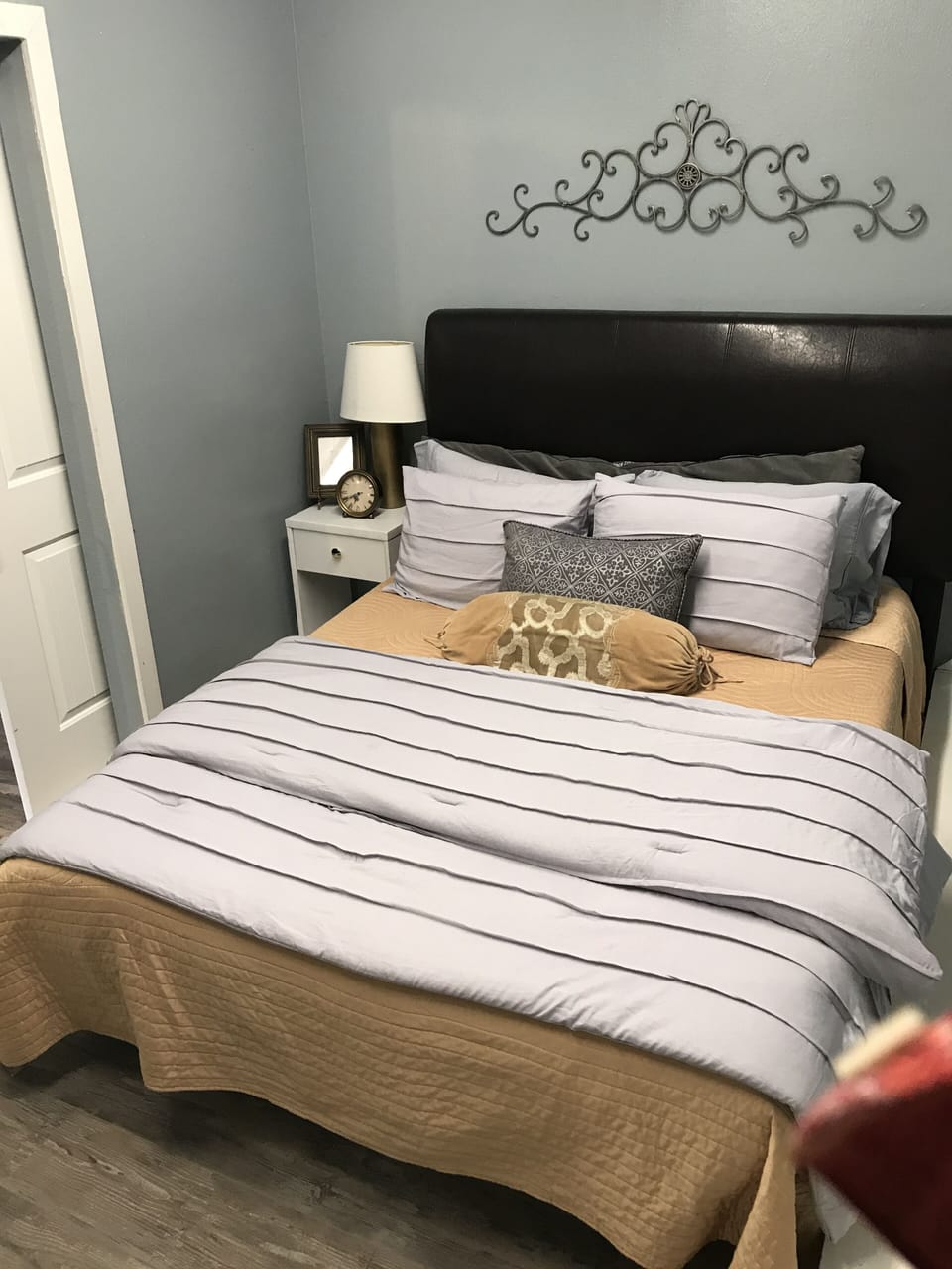 queen room with memory foam bed and smart TV sliding double barn doors. 