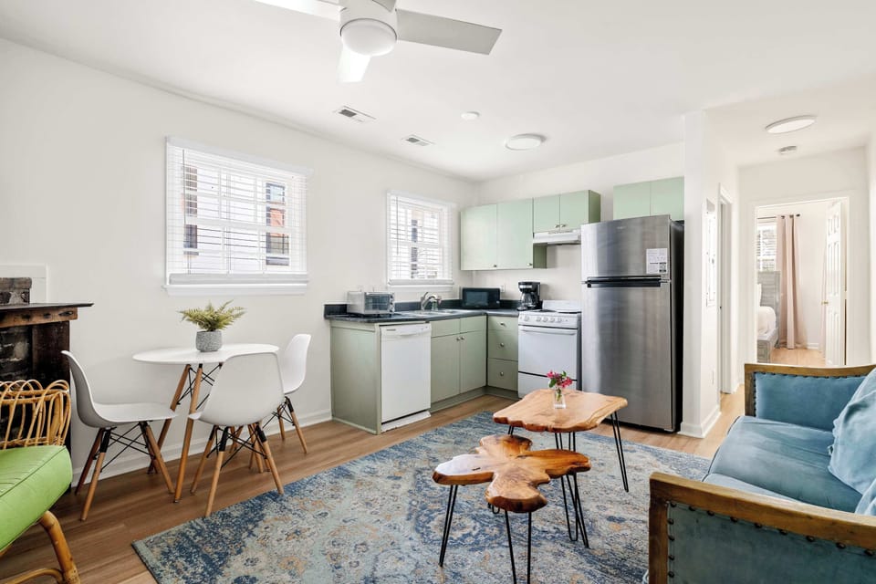Open space layout featuring living room with plenty of seating space for your group, TV and kitchen with dining and seating for three