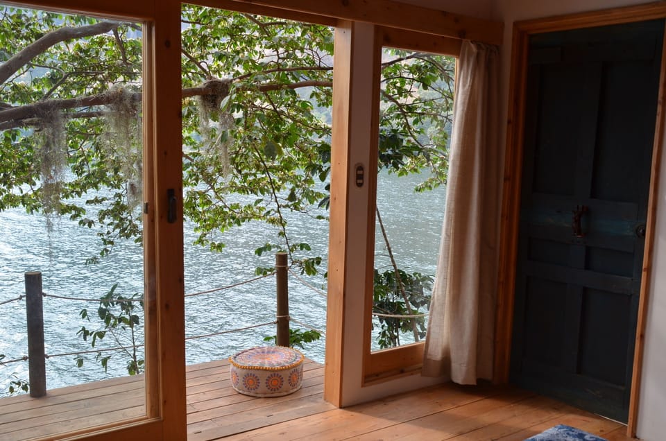 Bdrm with sliding door to the wooden deck, sit and feel inspired