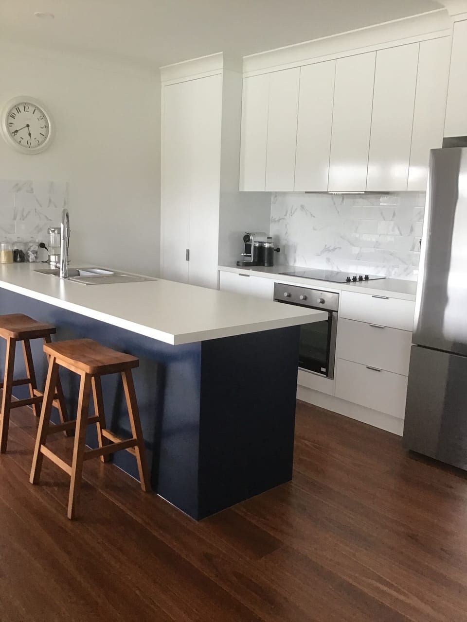 Kitchen with Nespresso coffee machine, dishwasher, microwave & bread machine.