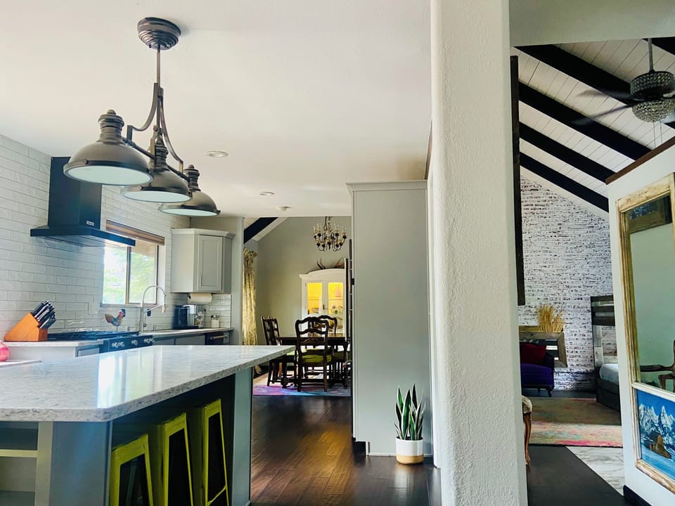 Open concept kitchen, dining room and two living rooms on main level.