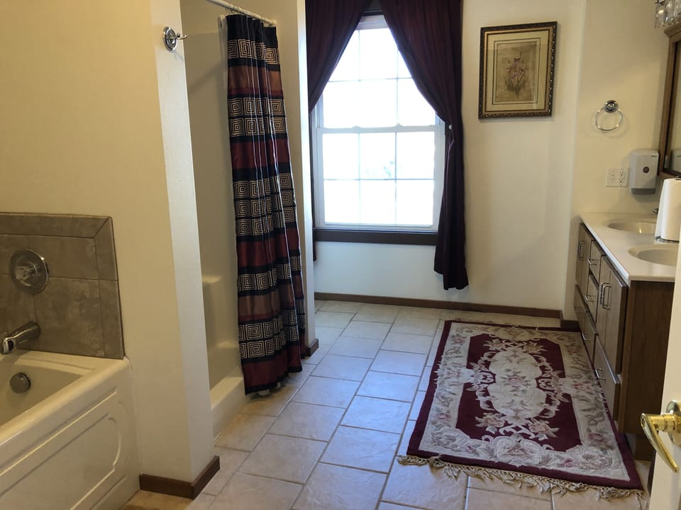 Front bathroom with tile floor heat and jacuzzi tub
