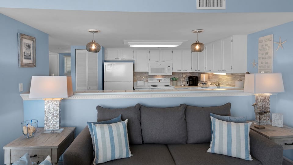 Kitchen opens up into living area
