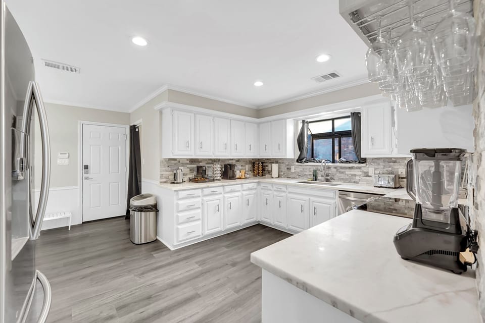 Large kitchen with smart fridge smart microwave smart oven smart dishwasher