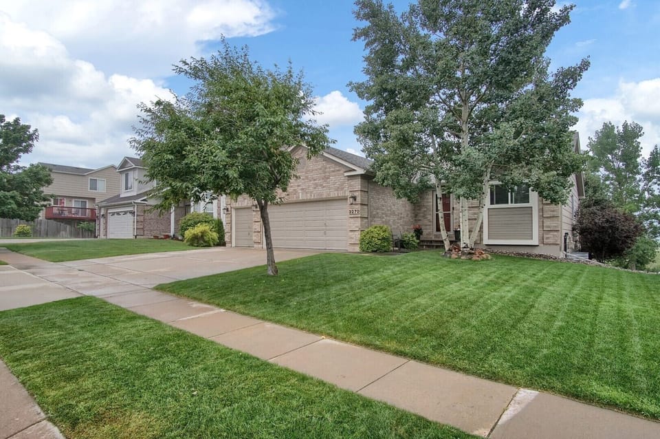 Front of home with parking on driveway.