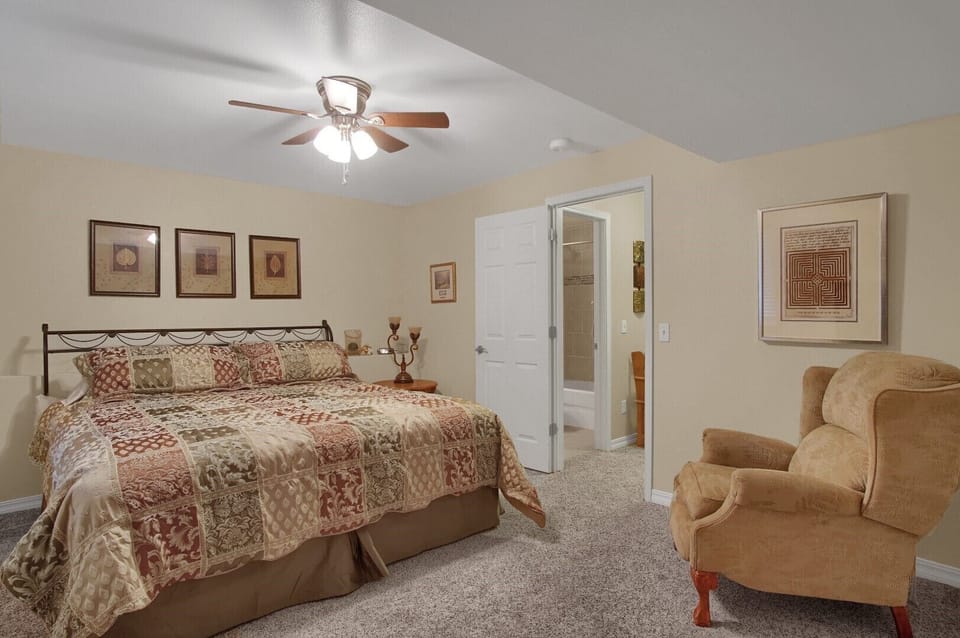 3rd bedroom in basement with a king bed. 