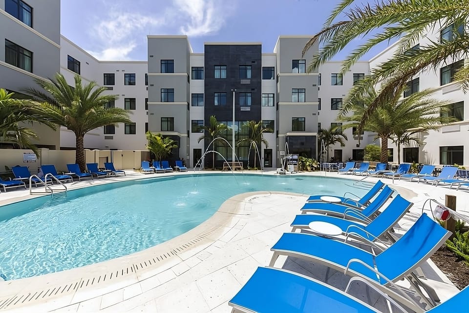 Float peacefully across the wide pool with open skies.