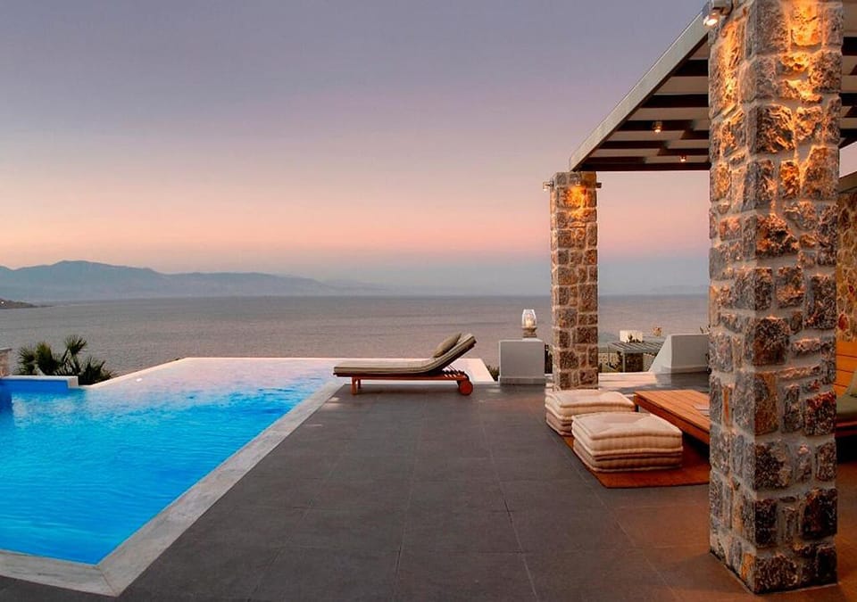 Pool lounge area. Infinity sea view