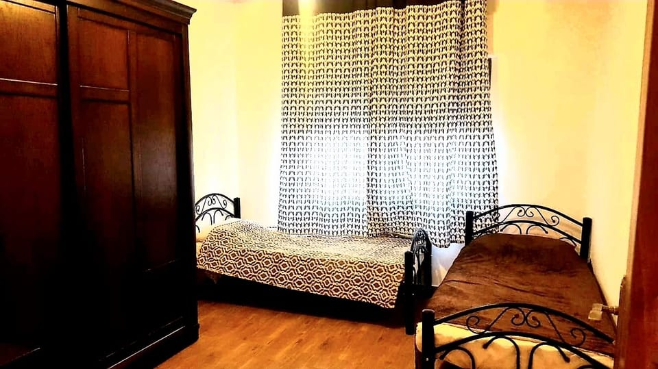 2 Beds Room, Also includes:Steam Iron, Ironing Board, Stand Fan, Vacuum Cleaner.