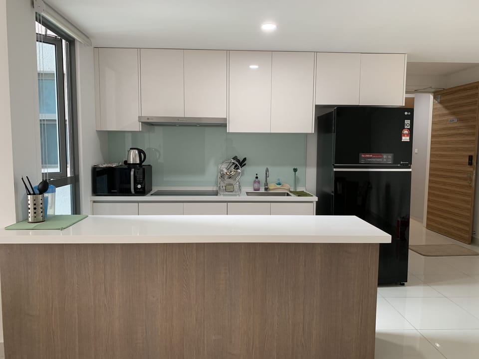 Modern kitchen with large pantry island (custom made), large fridge & microwave