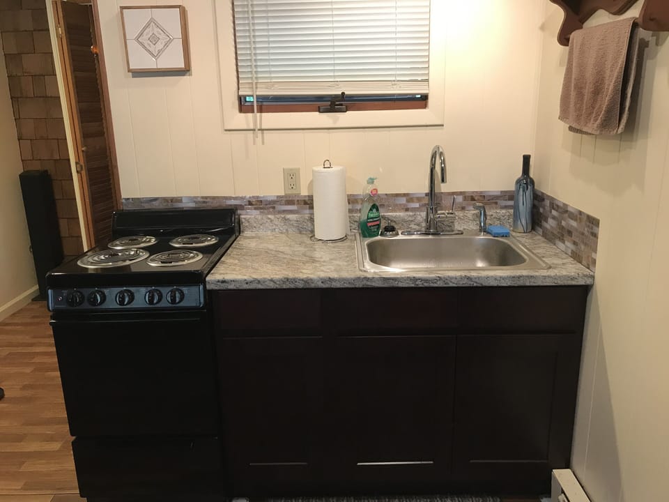 Kitchen area with stove/range 