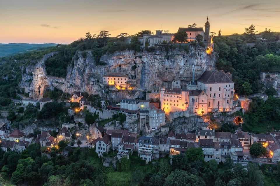 A magical view of Rocamadour at sunset—one of the most stunning UNESCO sites in France, waiting to be explored during your stay.