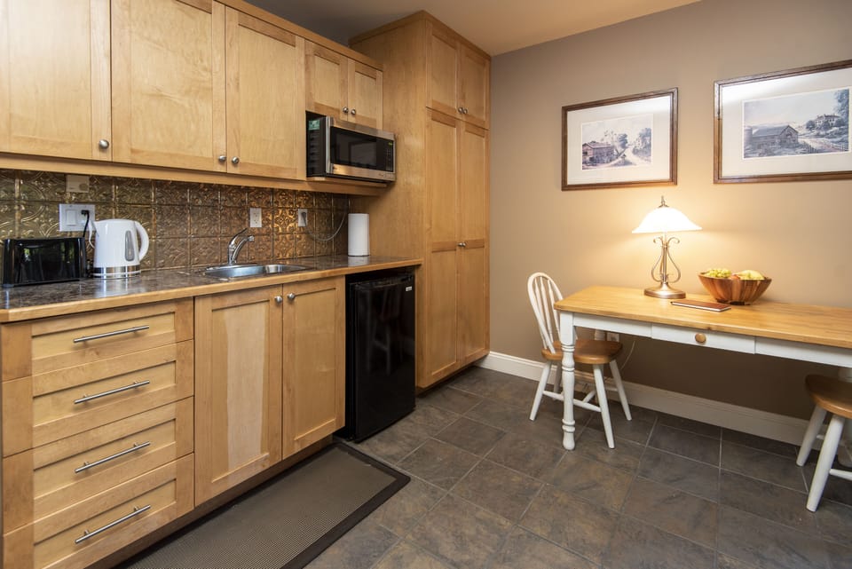 Kitchenette comes with a mini fridge, toaster, microwave, french press hotplate