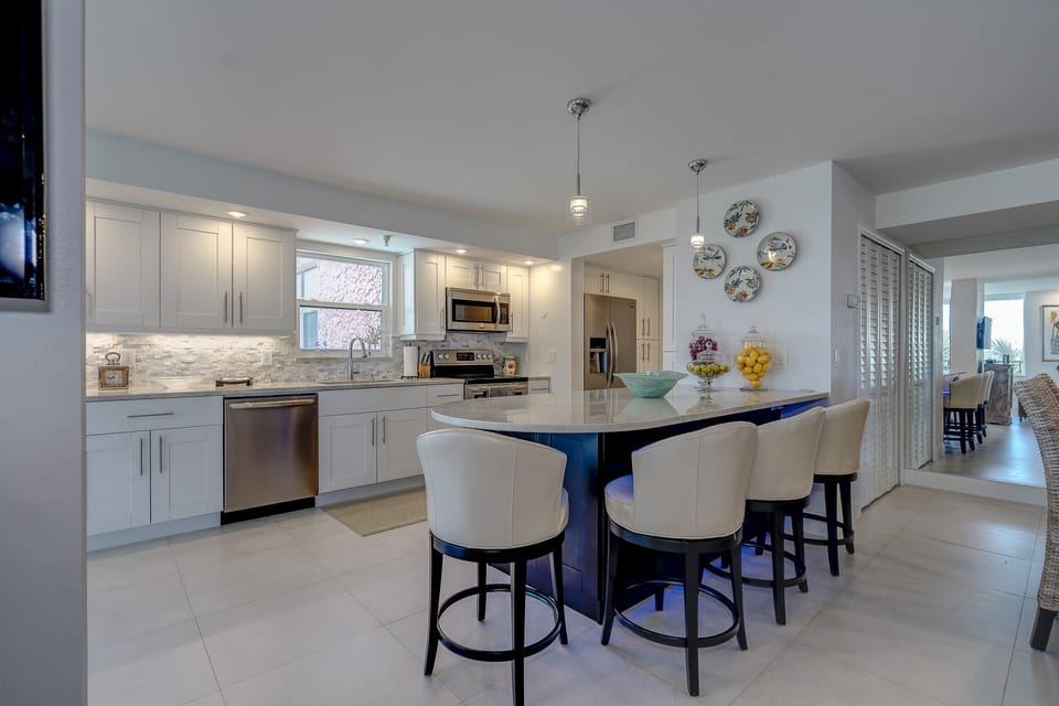 Open Kitchen - Gorgeous updated kitchen with views of the gulf and a bar for casual eating