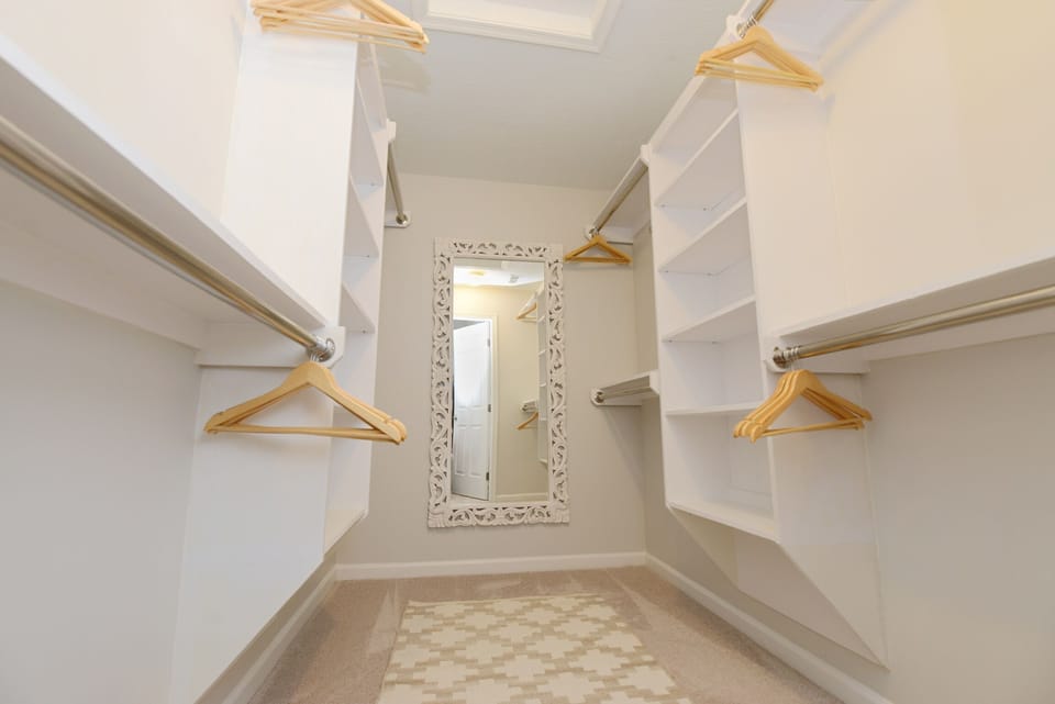 Primary walk-in closet. 