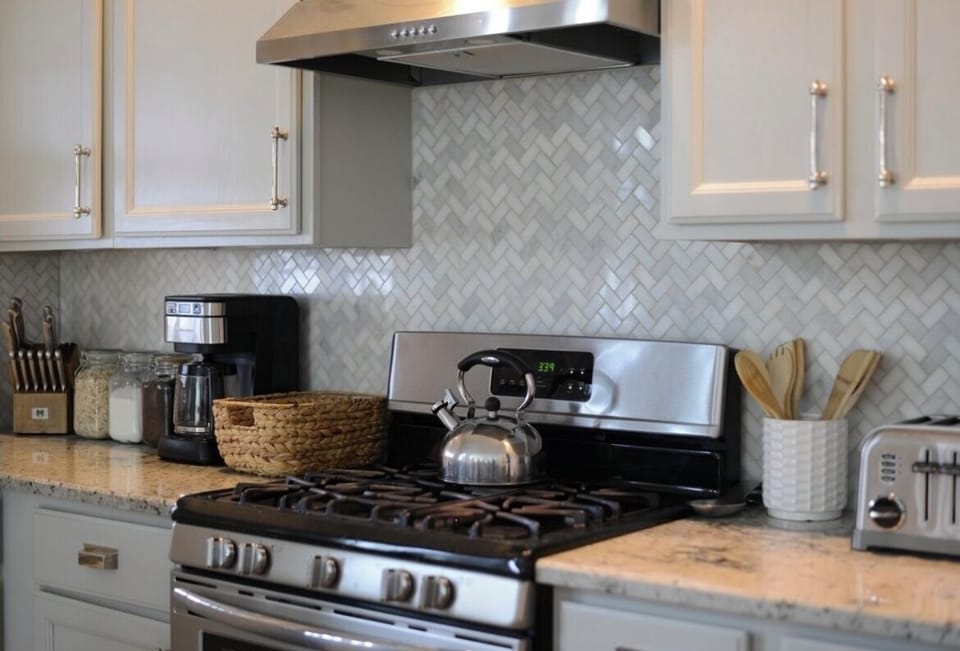 Kitchen is well stocked with dishes, utensils, pots and pans, spices, etc.
