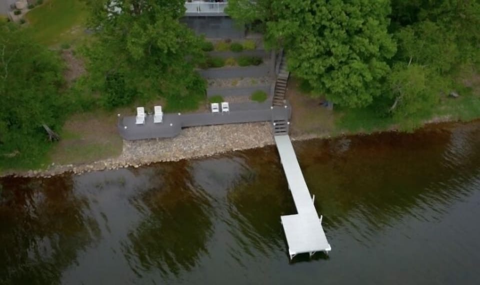 Aerial view of the lake side of property.