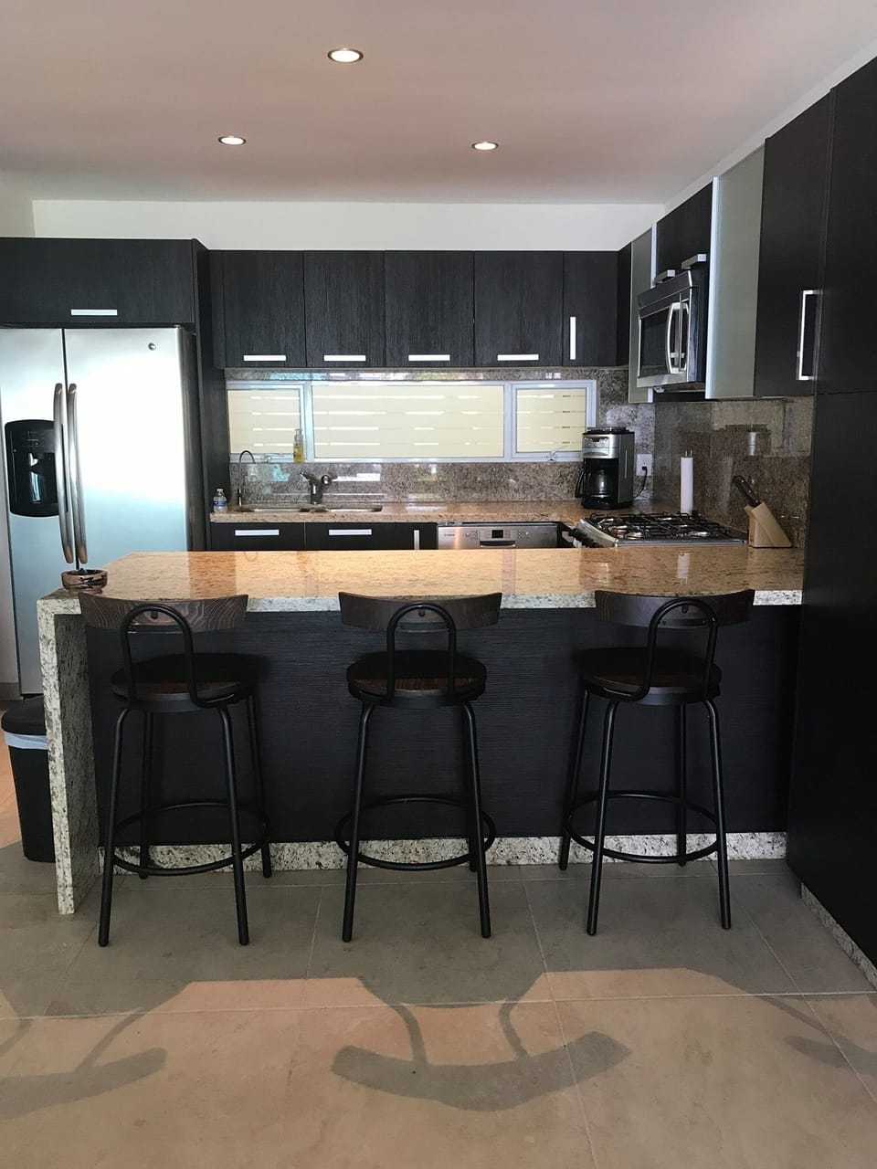 Complete kitchen with stainless steel appliances. 
