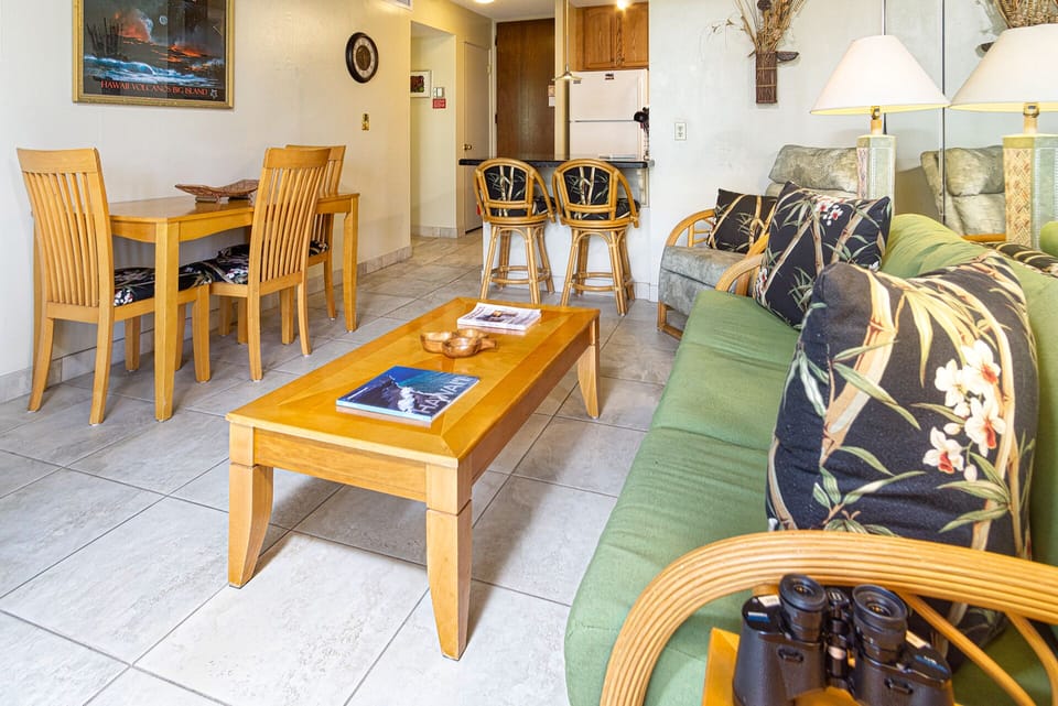 Bright living area with central A/C, ocean views, and a queen sofa bed for additional sleeping space.