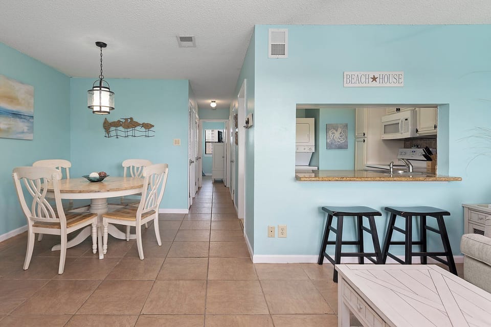 Living Area - View to Dining, Kitchen, and Hallway