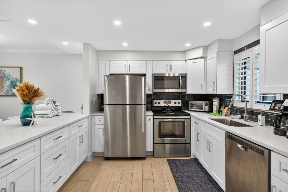 Kitchen with breakfast bar and stainless steel appliances