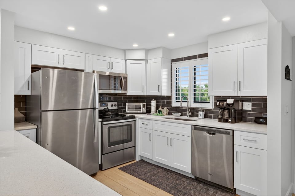 Kitchen with breakfast bar and stainless steel appliances