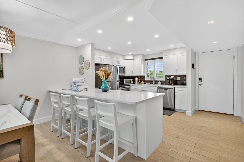 Kitchen with breakfast bar and stainless steel appliances
