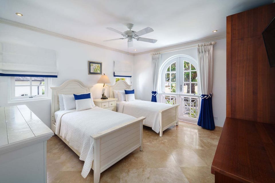 Third bedroom with two twin beds and television