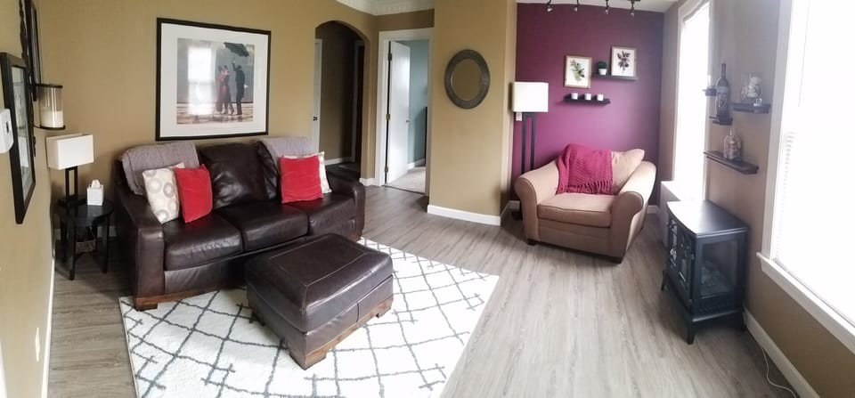 Leather couch, oversized chair, electric fireplace