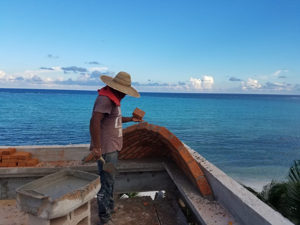 Worker completing the third story ceiling 