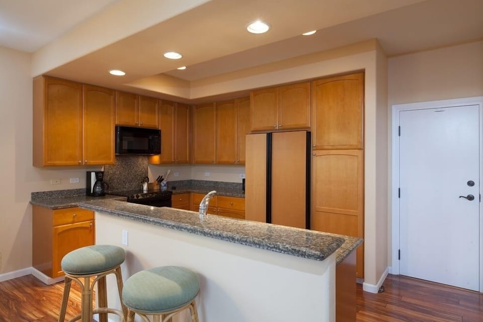 - Kitchen with plenty of storage, granite countertops, and all appliances.