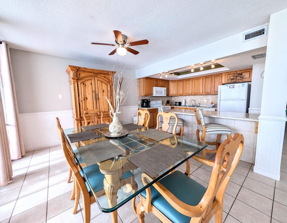 Sunlit dining area and open kitchen