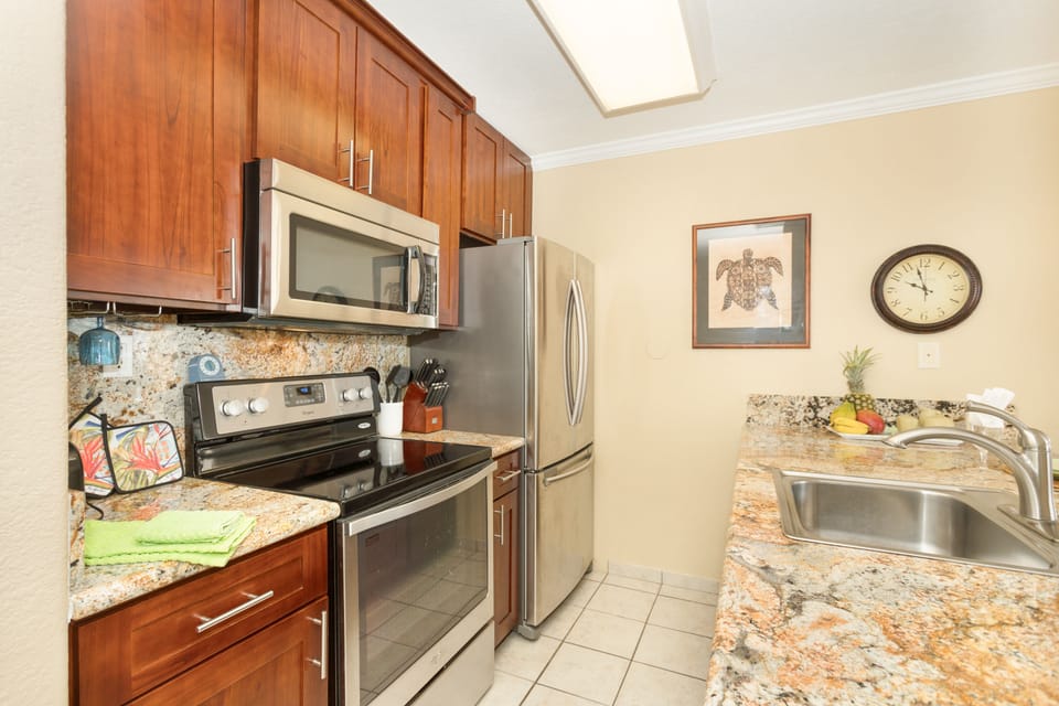 Remodeled full sized kitchen with amazing view for the chef. Granite countertops, full-size stainless appliances, and everything needed for cooking at home—plus an ocean view right from the kitchen.