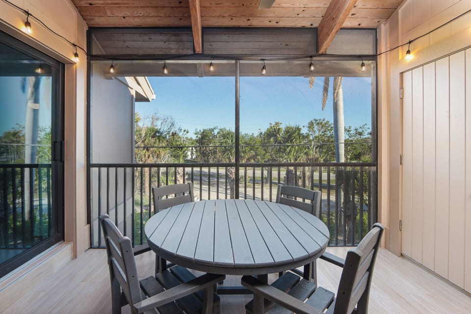 Screend lanai with outdoor table