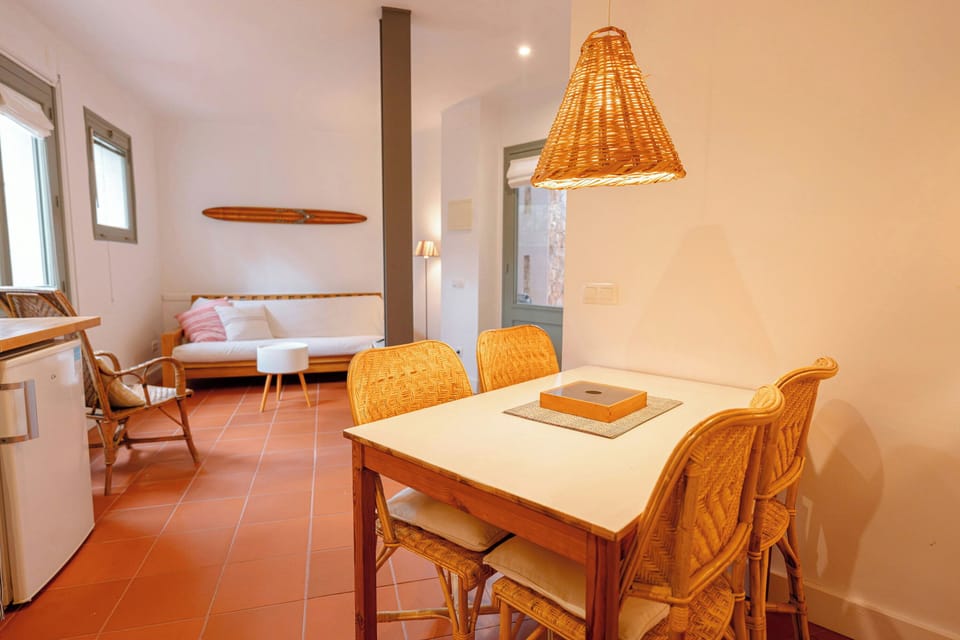 The dining table provides a cozy space for sharing Mediterranean meals.