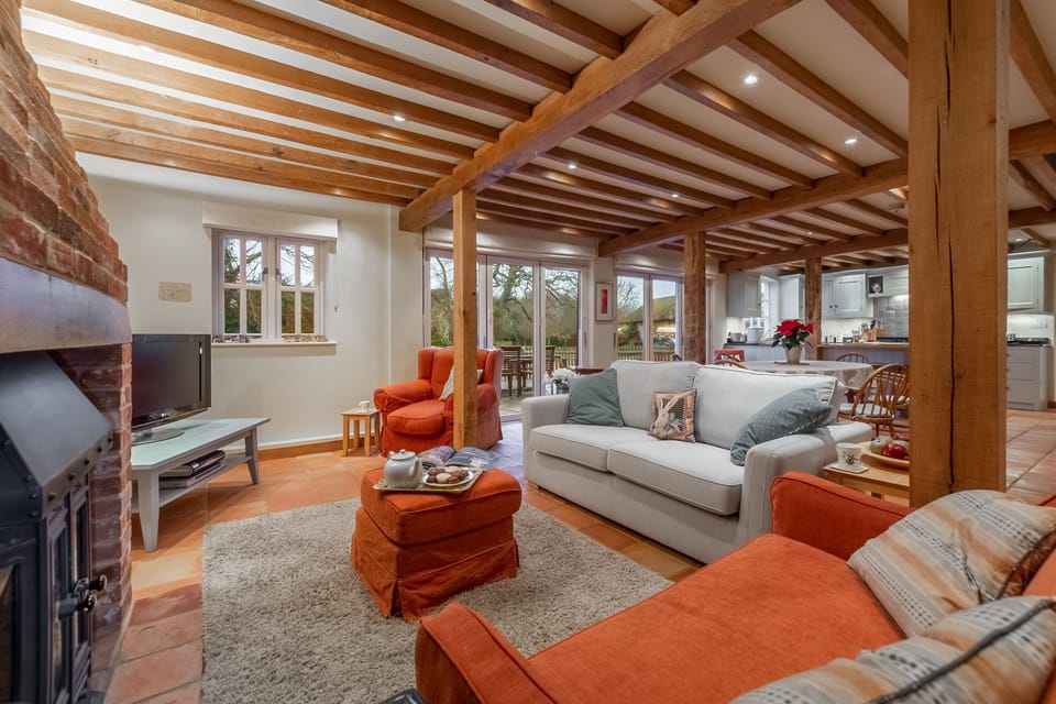 Ground floor: The open-plan sitting room with wood burning stove