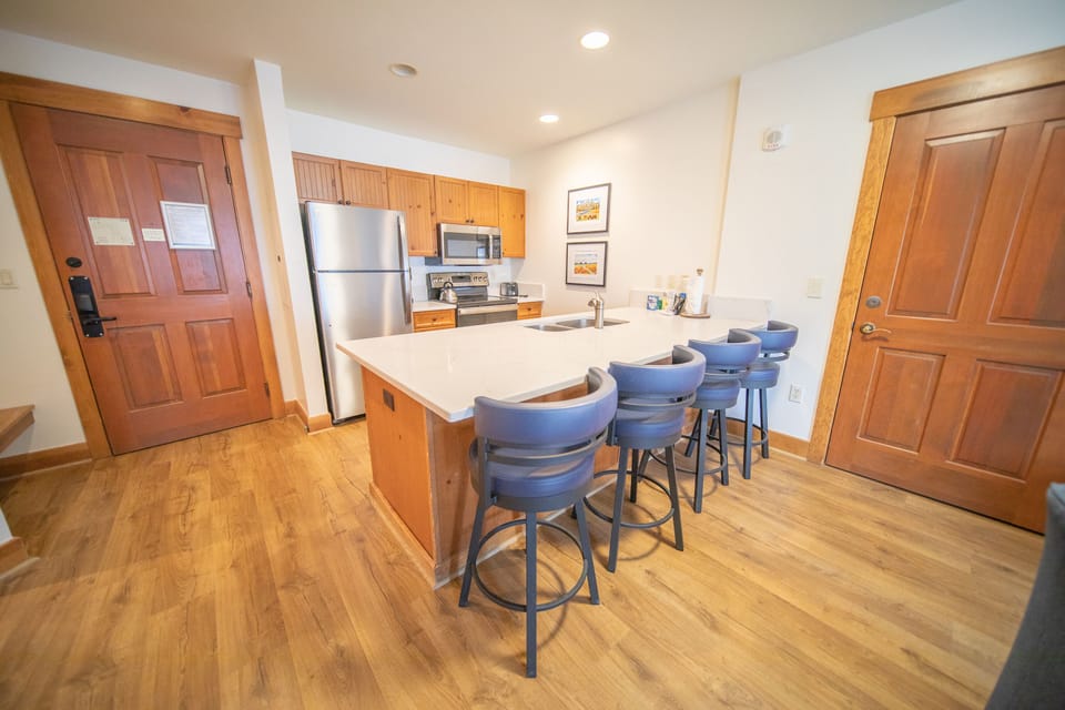 Brand new kitchen with stainless and quartz countertop