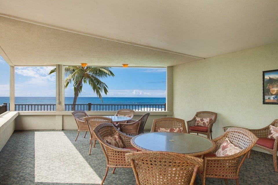 For guests and residents, a shady lanai overlooking pool.