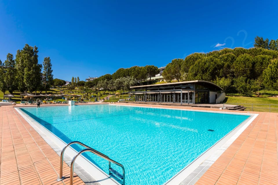 Large communal swimming pool with wooden sun deck at Marina Park resort, Lagos, Algarve