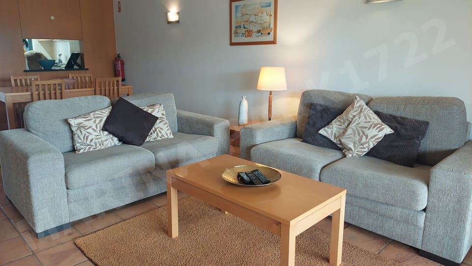 Comfortable living room with modern sofa and coffee table in Marina Park apartment, Lagos, Algarve