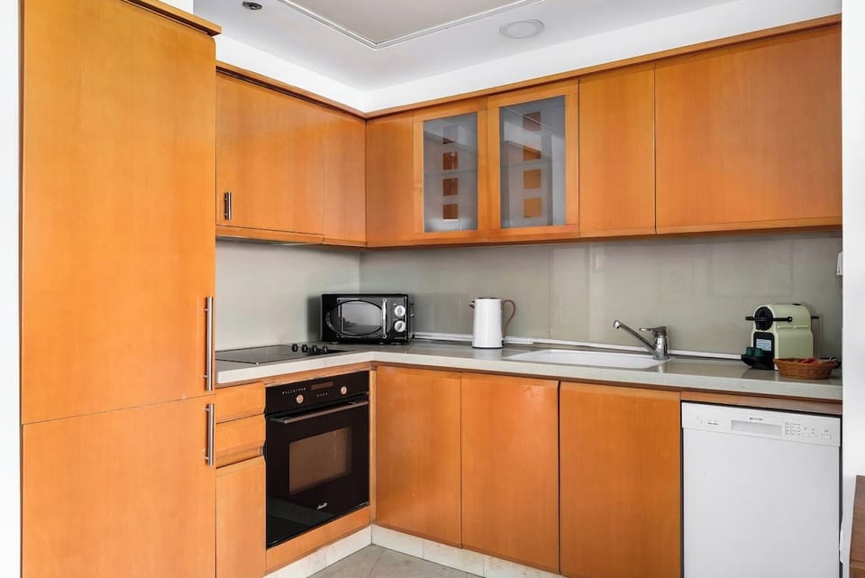 Cozy kitchen nook with a Nespresso machine and complimentary coffee. 