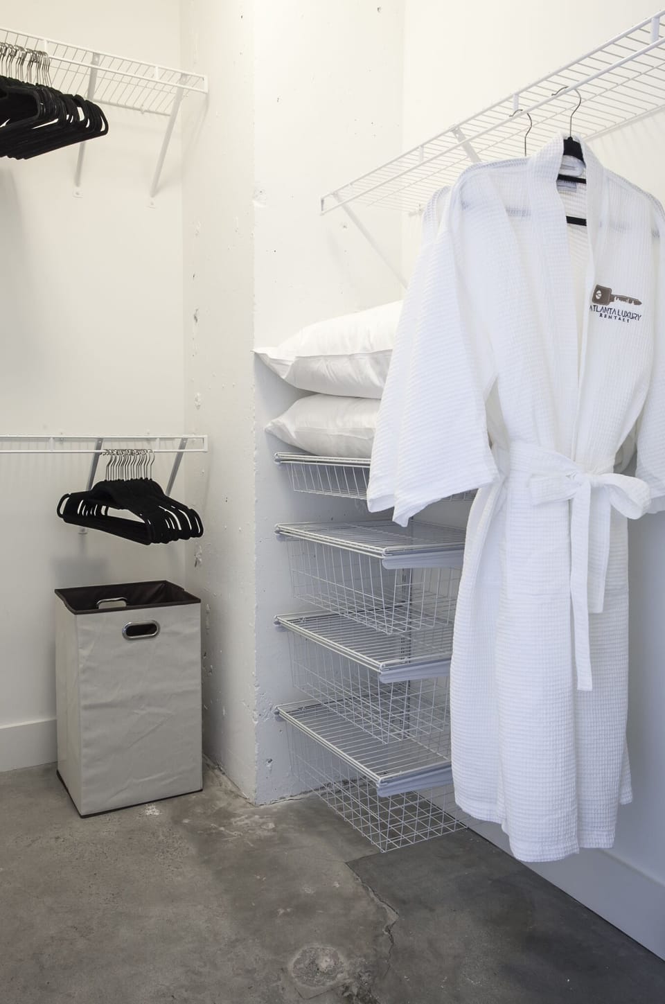 Closet with a robe hanging inside it.