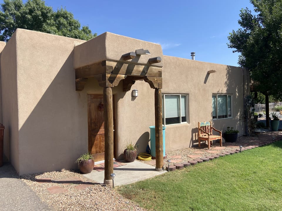 Main entrance off driveway with private parking